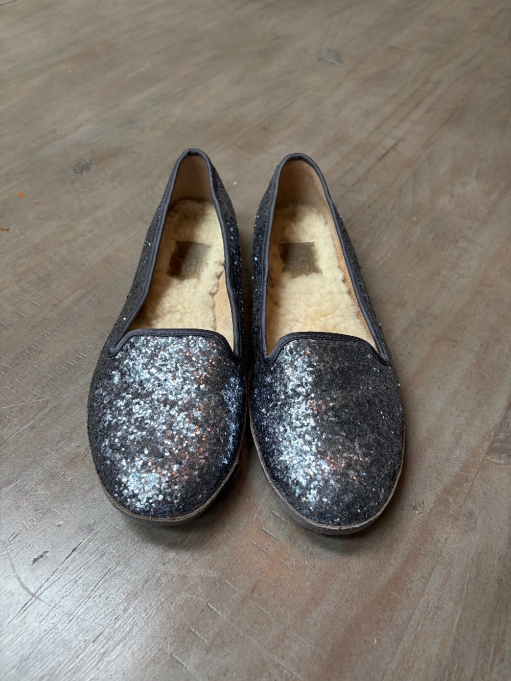 UGG Alloway blue, glitter slippers with fleece lining.